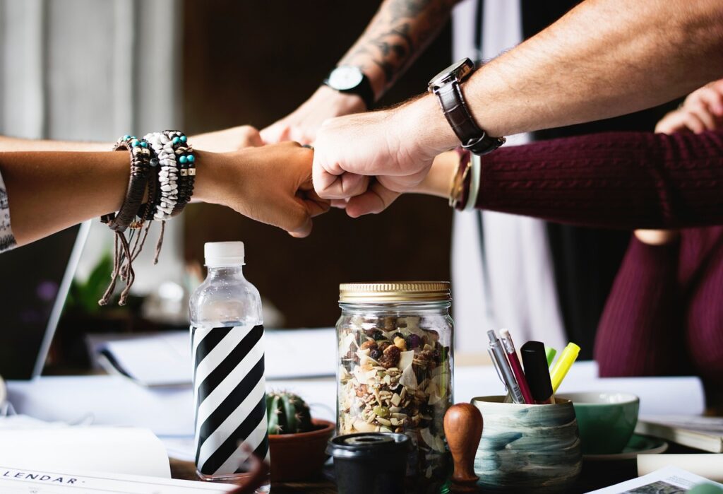 friends fist-bumping, sharing support, mental health and dieting