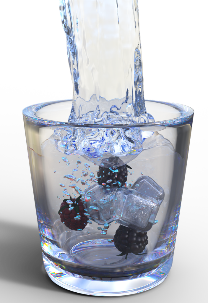 water splashing into a glass with ice and berries